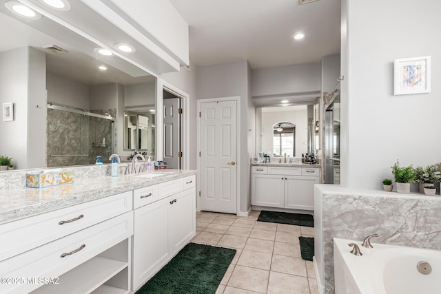 bathroom with a stall shower, recessed lighting, a garden tub, vanity, and tile patterned flooring