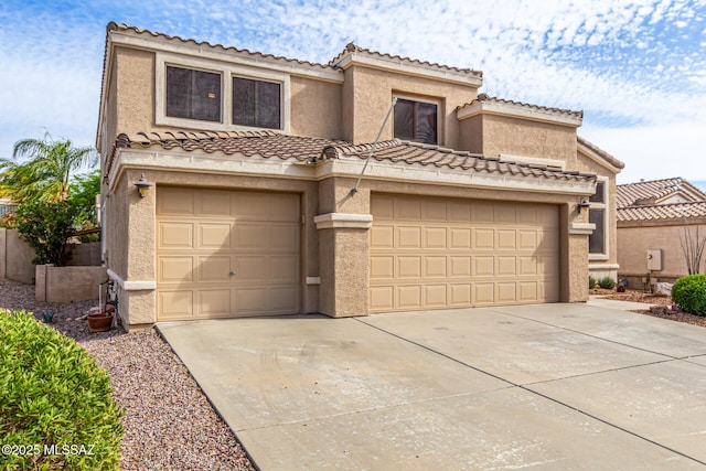 view of front facade with a tile roof, driveway, and stucco siding