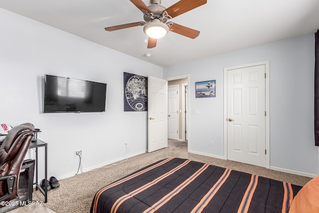 bedroom featuring a ceiling fan, carpet flooring, and baseboards