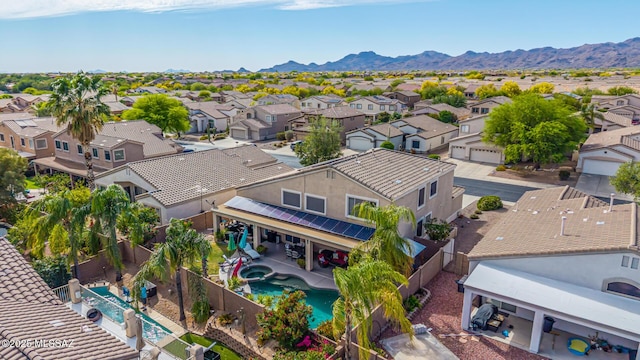 birds eye view of property with a residential view and a mountain view