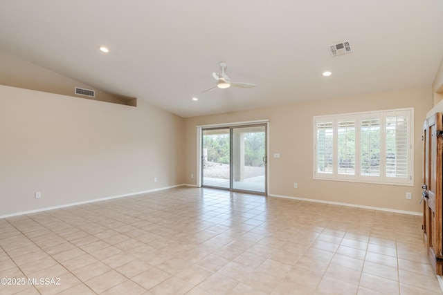 empty room featuring lofted ceiling, a ceiling fan, visible vents, and recessed lighting