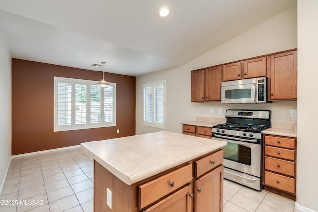 kitchen featuring brown cabinets, stainless steel appliances, light countertops, visible vents, and light tile patterned floors