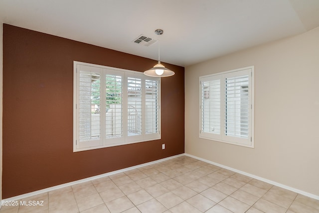 unfurnished dining area featuring visible vents and baseboards