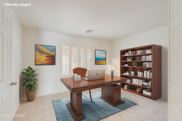 home office featuring visible vents and light tile patterned flooring
