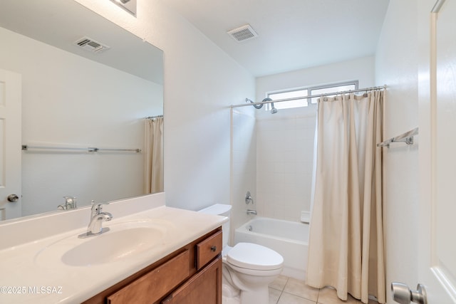 bathroom with visible vents, toilet, vanity, and tile patterned floors