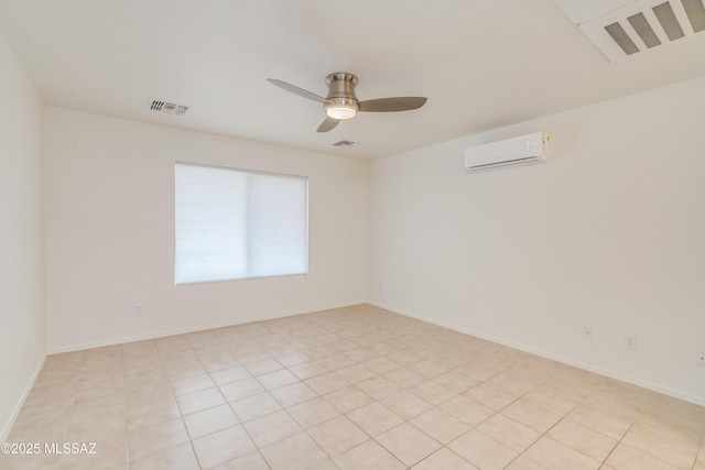 unfurnished room featuring a wall mounted air conditioner, a ceiling fan, and visible vents
