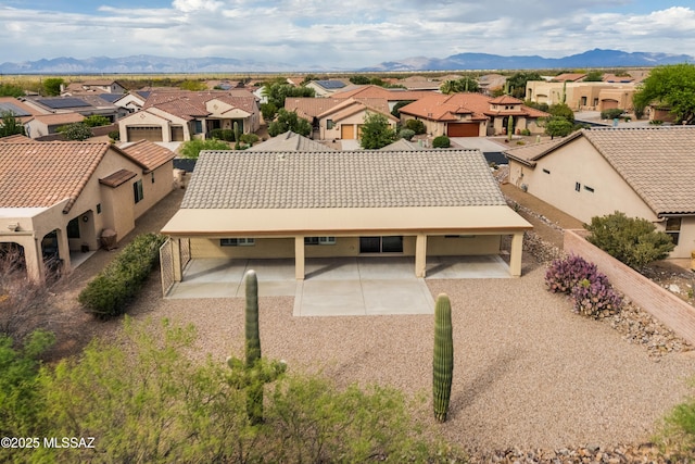 birds eye view of property with a residential view and a mountain view