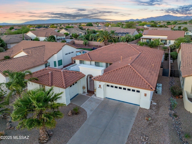 bird's eye view with a residential view and a mountain view