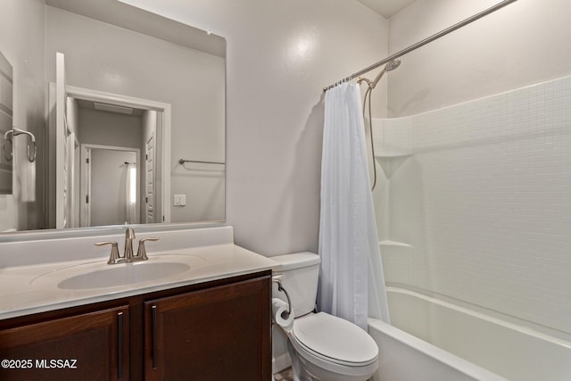 bathroom featuring toilet, vanity, and shower / bath combo with shower curtain