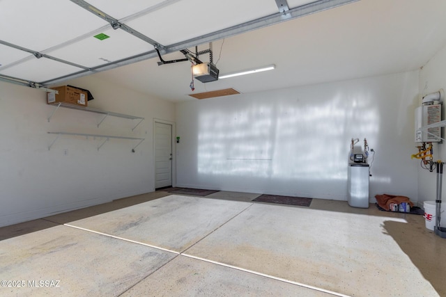 garage with water heater and a garage door opener
