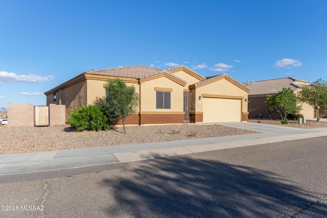 single story home featuring stucco siding, an attached garage, driveway, and a tiled roof