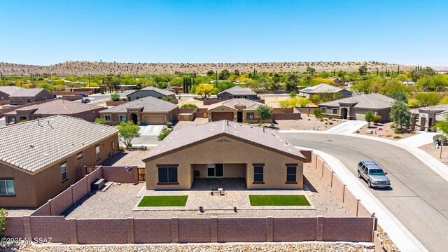 drone / aerial view featuring a mountain view and a residential view