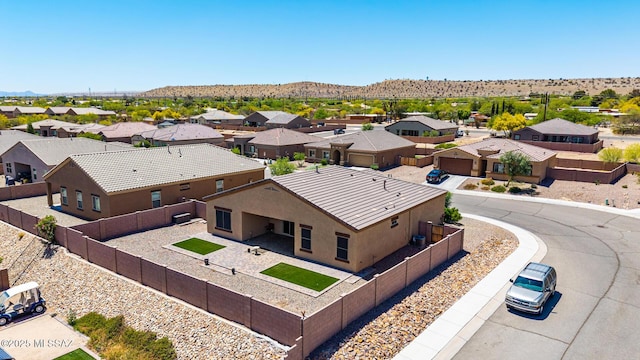 birds eye view of property with a mountain view and a residential view