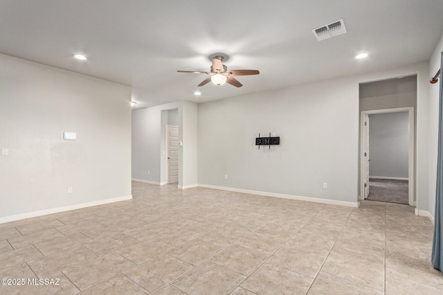 spare room featuring recessed lighting, visible vents, baseboards, and ceiling fan