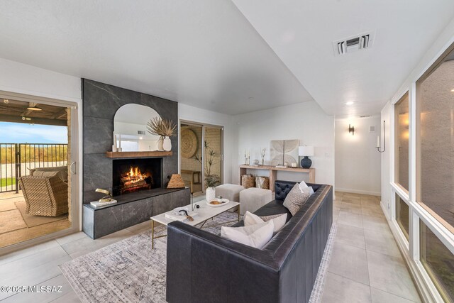 3855 N Via Avellana, Tucson, AZ 85718 - living room with light tile patterned flooring and a large fireplace
