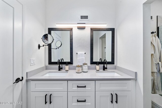 3855 N Via Avellana, Tucson, AZ 85718 - bathroom with double vanity and toilet