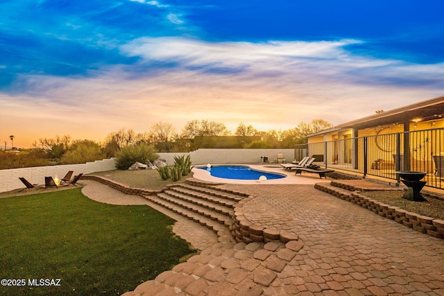 3855 N Via Avellana, Tucson, AZ 85718 - pool at dusk with a patio and a fenced backyard
