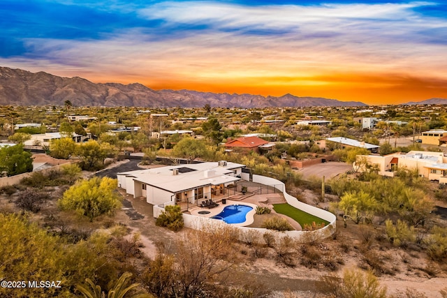 3855 N Via Avellana, Tucson, AZ 85718 - aerial view at dusk of a mountain view, view of pool area, and a residential view