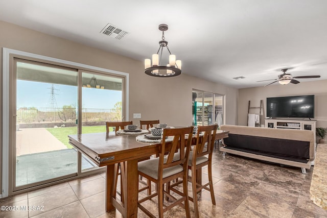 9528 S Desert Fauna Loop, Tucson, AZ 85747 - dining space featuring ceiling fan with notable chandelier, plenty of natural light, and visible vents