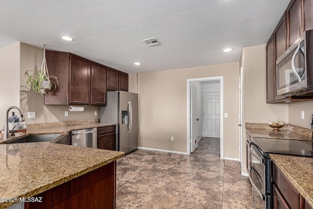 9528 S Desert Fauna Loop, Tucson, AZ 85747 - kitchen featuring a sink, dark brown cabinets, baseboards, visible vents, and appliances with stainless steel finishes