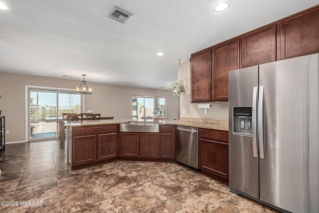 9528 S Desert Fauna Loop, Tucson, AZ 85747 - kitchen featuring a sink, a peninsula, appliances with stainless steel finishes, visible vents, and recessed lighting