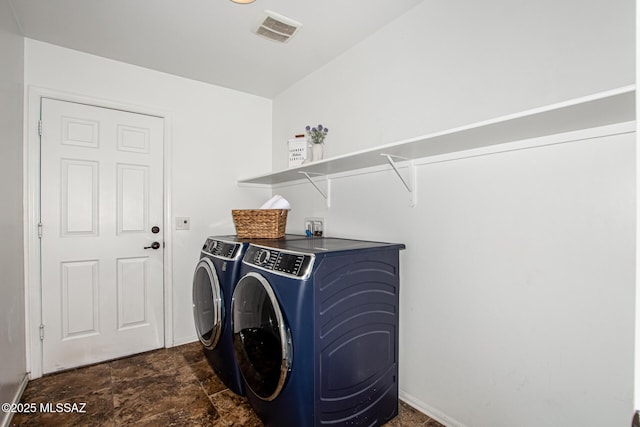 9528 S Desert Fauna Loop, Tucson, AZ 85747 - laundry area with baseboards, visible vents, stone finish flooring, washer and dryer, and laundry area