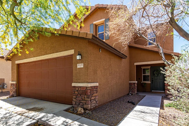 9528 S Desert Fauna Loop, Tucson, AZ 85747 - view of front of house featuring stone siding, a tiled roof, a garage, and stucco siding