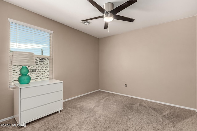 9528 S Desert Fauna Loop, Tucson, AZ 85747 - unfurnished room featuring light colored carpet, ceiling fan, baseboards, and visible vents