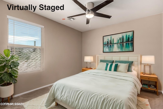 9528 S Desert Fauna Loop, Tucson, AZ 85747 - bedroom with carpet floors, a ceiling fan, visible vents, and baseboards