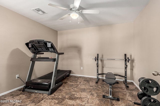 9528 S Desert Fauna Loop, Tucson, AZ 85747 - exercise room featuring baseboards, a ceiling fan, stone finish floor, and visible vents