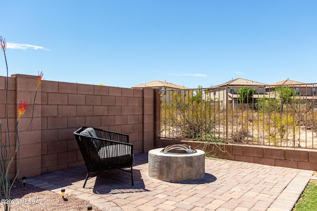 9528 S Desert Fauna Loop, Tucson, AZ 85747 - view of patio / terrace with fence and a fire pit