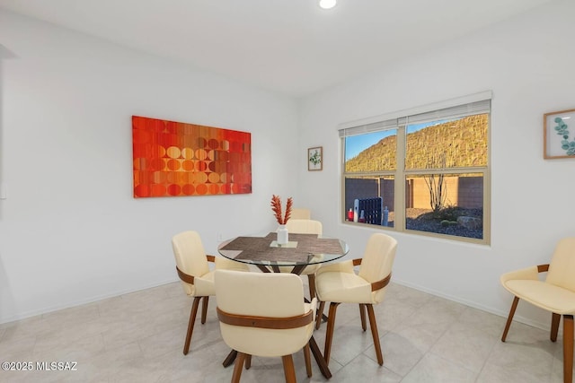 dining area with recessed lighting and baseboards