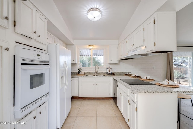 2826 W Jacinto St, Tucson, AZ 85745 - kitchen featuring white appliances, a sink, light tile patterned floors, and white cabinetry