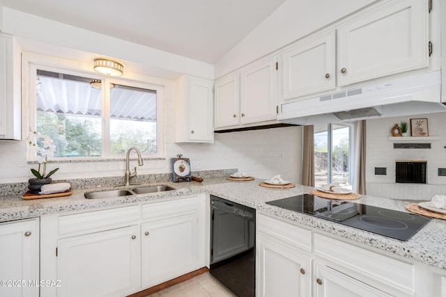 2826 W Jacinto St, Tucson, AZ 85745 - kitchen with black appliances, under cabinet range hood, a sink, white cabinets, and plenty of natural light