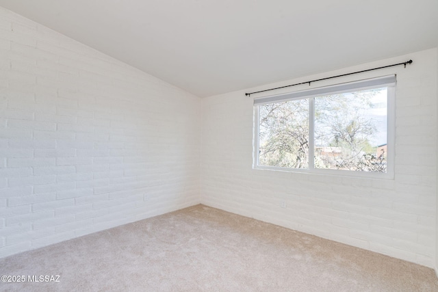 2826 W Jacinto St, Tucson, AZ 85745 - spare room featuring carpet flooring and vaulted ceiling