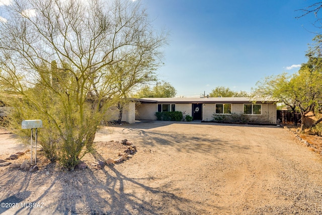 2826 W Jacinto St, Tucson, AZ 85745 - single story home featuring brick siding, fence, and dirt driveway