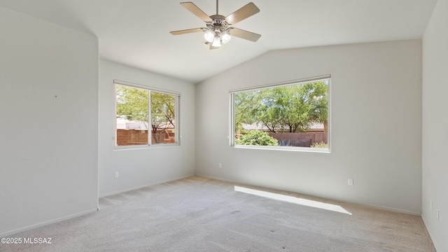 12693 N Rye Dr, Marana, AZ 85653 - unfurnished room featuring light colored carpet, lofted ceiling, ceiling fan, and baseboards