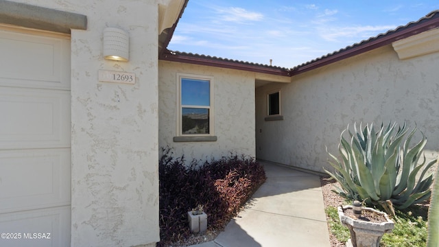 12693 N Rye Dr, Marana, AZ 85653 - property entrance with stucco siding and a tiled roof