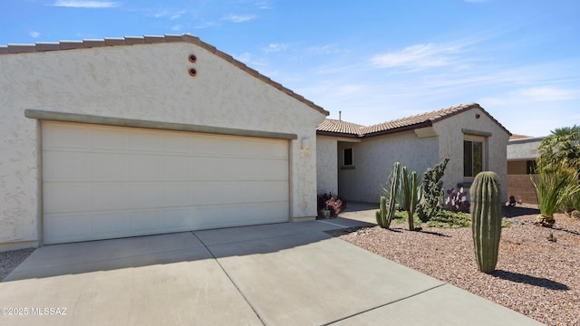 12693 N Rye Dr, Marana, AZ 85653 - mediterranean / spanish house featuring driveway, stucco siding, a garage, and a tiled roof