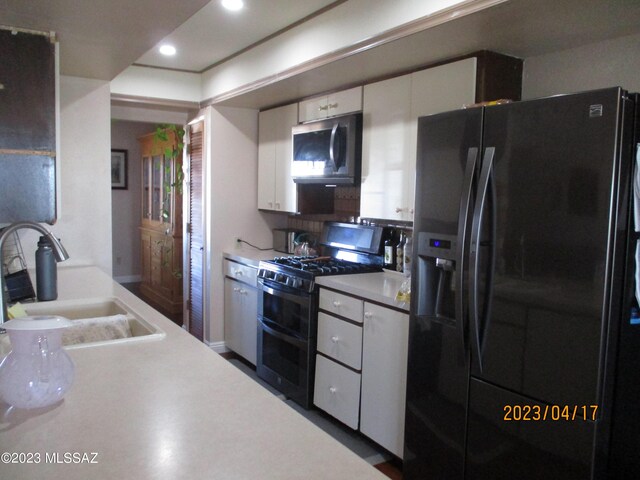 2583 W Arcadia Ln, Willcox, AZ 85643 - kitchen featuring recessed lighting, stainless steel appliances, light countertops, a sink, and white cabinetry