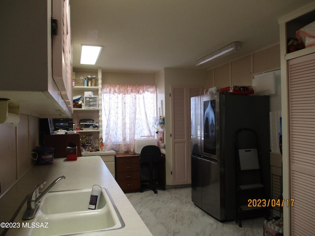 2583 W Arcadia Ln, Willcox, AZ 85643 - kitchen featuring light countertops, freestanding refrigerator, open shelves, and a sink