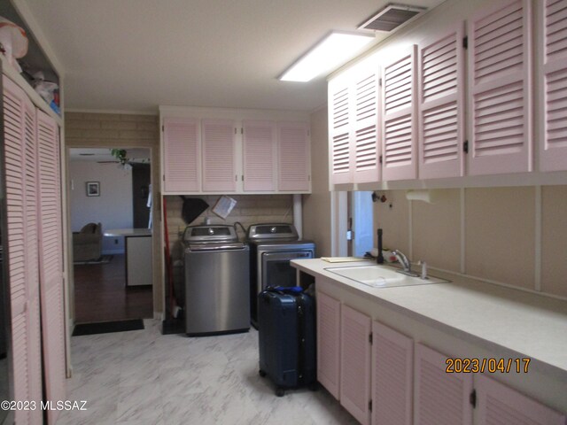 2583 W Arcadia Ln, Willcox, AZ 85643 - laundry area with cabinet space, visible vents, a sink, and separate washer and dryer