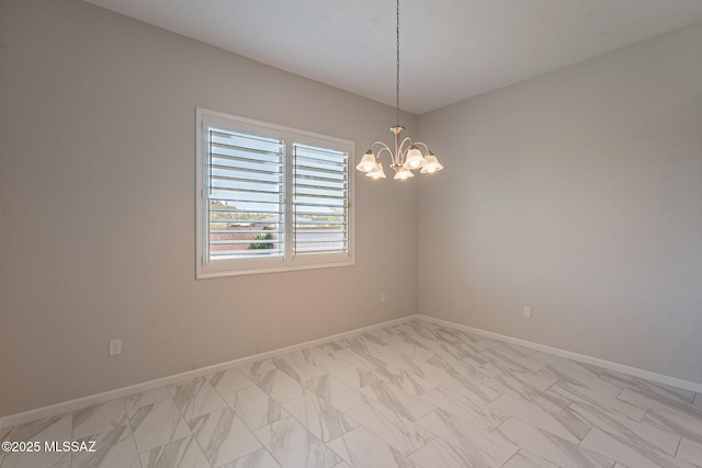 435 E Day Flower Dr, Tucson, AZ 85755 - empty room with light marble finish floors and a chandelier