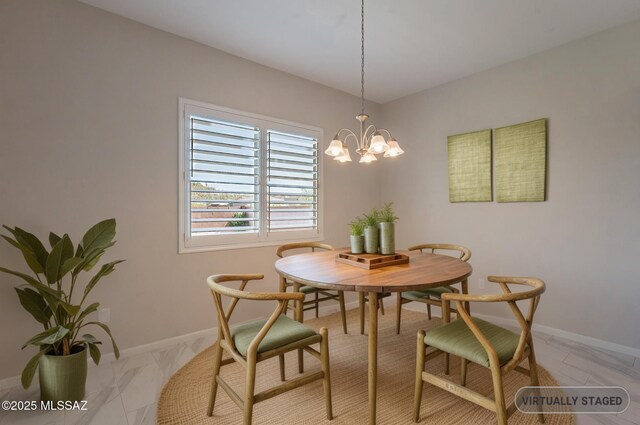 435 E Day Flower Dr, Tucson, AZ 85755 - dining room featuring a chandelier and light marble finish flooring