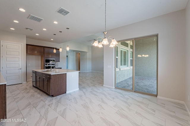 435 E Day Flower Dr, Tucson, AZ 85755 - kitchen featuring stainless steel appliances, light countertops, a chandelier, dark brown cabinets, and recessed lighting