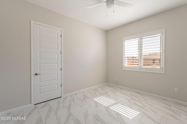 435 E Day Flower Dr, Tucson, AZ 85755 - empty room with ceiling fan and light marble finish flooring