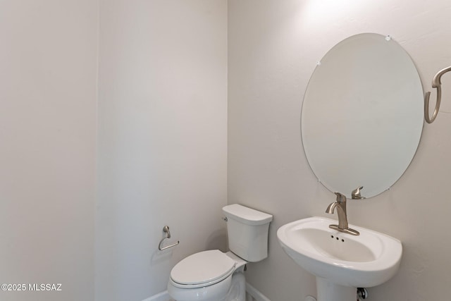 435 E Day Flower Dr, Tucson, AZ 85755 - half bathroom with a sink and baseboards