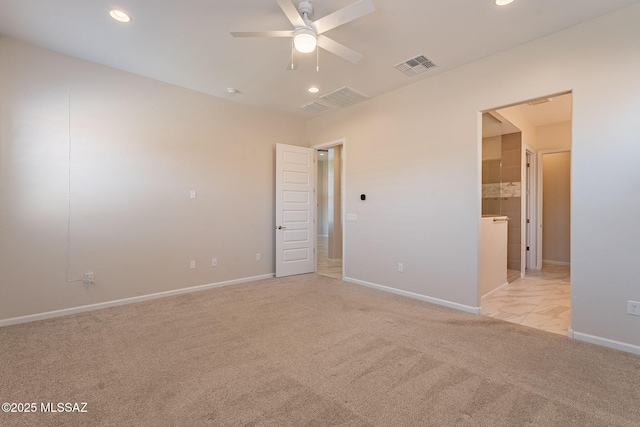 435 E Day Flower Dr, Tucson, AZ 85755 - unfurnished bedroom featuring light carpet, recessed lighting, and connected bathroom