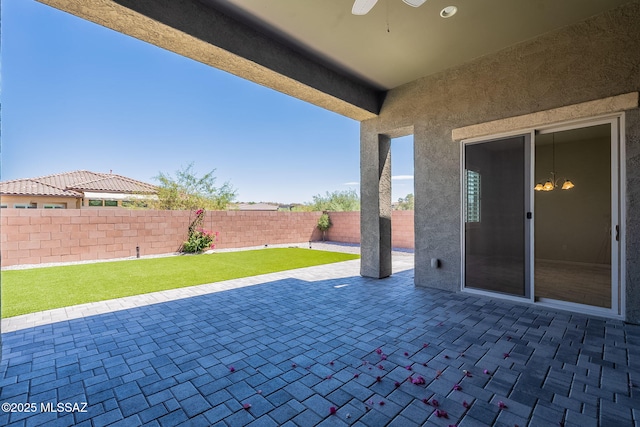 435 E Day Flower Dr, Tucson, AZ 85755 - fenced backyard featuring a ceiling fan and a patio