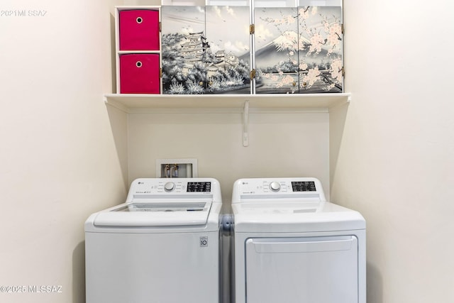 laundry room featuring washing machine and dryer and laundry area